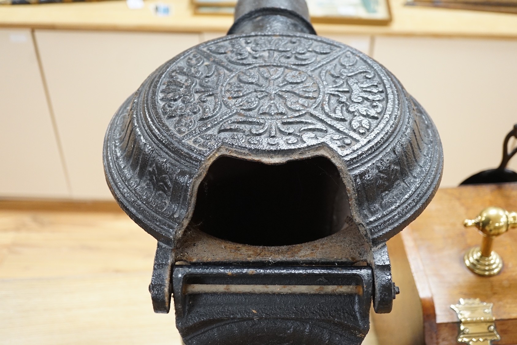 A black cast iron stove - 'The Slogan Stove’, 58cm high